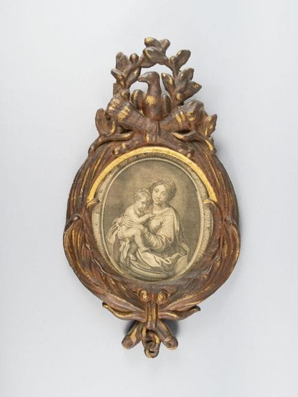 Miroir à vue ovale en bois sculpté anciennement do