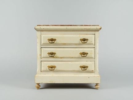 Miniature chest of drawers made of natural wood wi