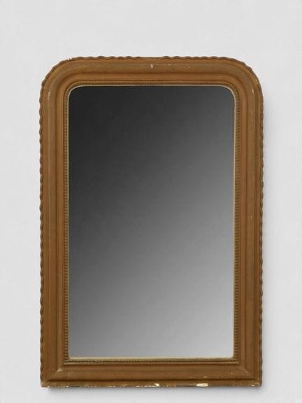 Miroir en bois et stuc doré laqué brun.
XIXe
H. 11