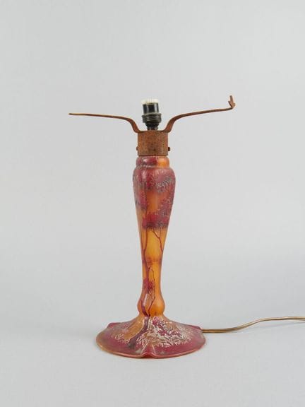 Glass lamp base with a multi-layered, acid-etched 