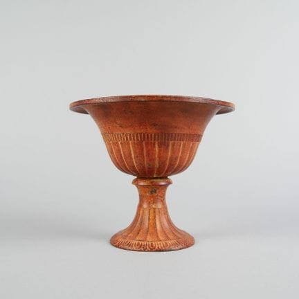 Metal bowl on a fluted pedestal with a medal-like 