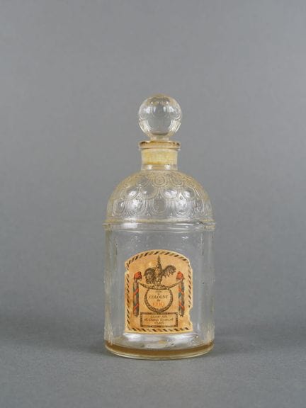 Empty "Eau de Cologne du Coq Guerlain Paris" bottl