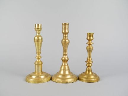 3 19th-century-style gilded metal candlesticks or 