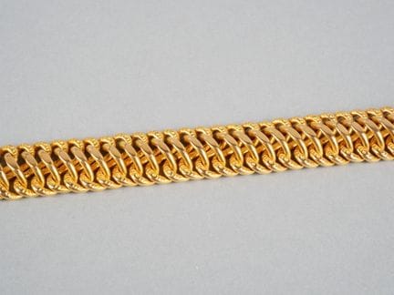 Armband aus vergoldetem Metall mit amerikanischem 