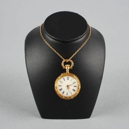 Collar watch with an 18K yellow gold case and beze
