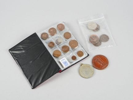 Lot:
- Small album containing approximately 50 met