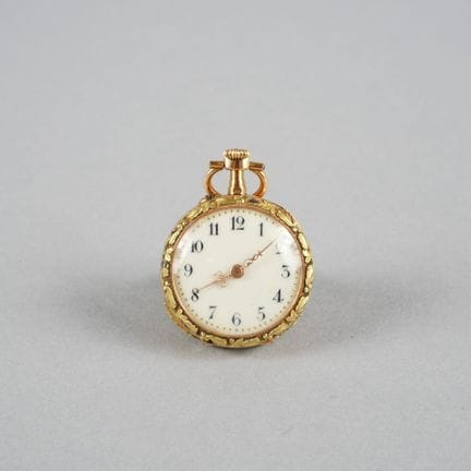 Collar watch with an 18K yellow gold case and beze