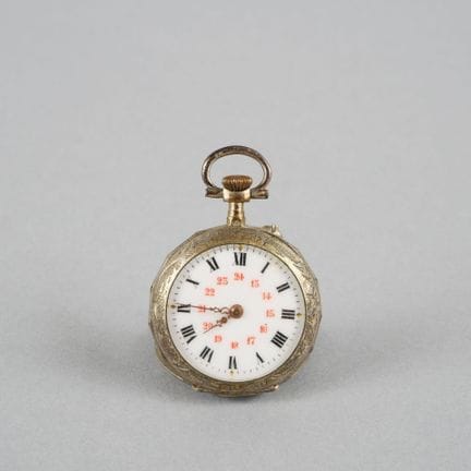 Collar watch with a silver case and bezel. White e