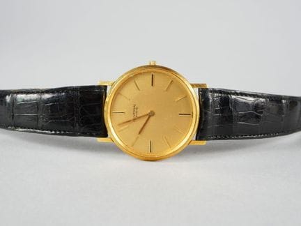 UNIVERSAL GENEVE. Wristwatch with an 18K yellow go