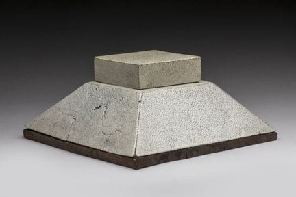 In the style of Clément Rousseau
Pyramid-shaped in
