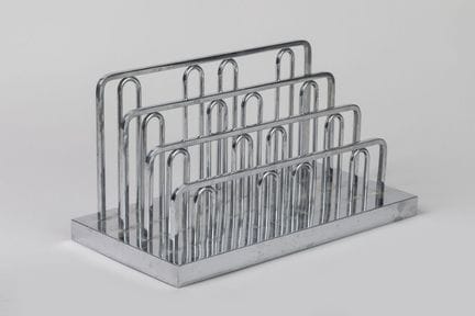 In the style of Jacques Adnet 
Chrome-plated metal
