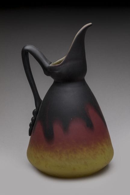 Schneider
A bulbous, long-necked pitcher made of m