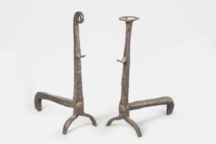 Two fire pokers and poker rests in a brutalist sty