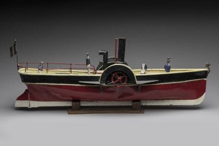JOUET d'enfant en tôle laquée figurant un bateau à