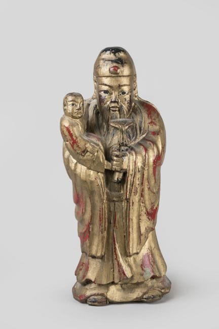 Zen-Mönch, der ein Kind in den Armen hält, aus ver