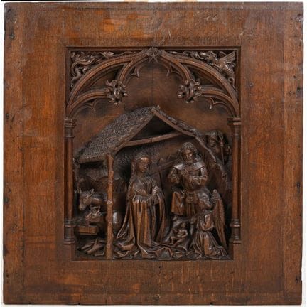 Eichenholztafel mit einer Krippenszene im Hochreli