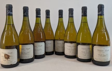 8 bottles:
- 5 bottles of Domaine Laroche, Chablis