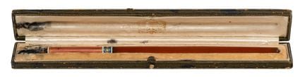Resin body with gold-plated accents, stored in its