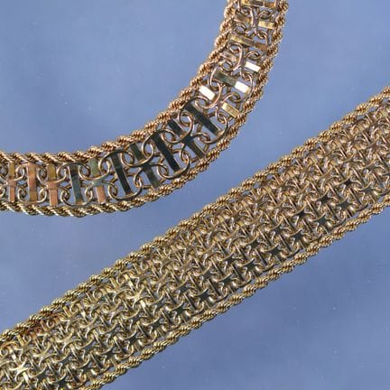 DEMI-PARURE en or jaune à maille souple à décor d'