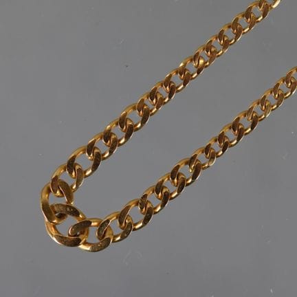 COLLIER en or jaune maille gourmette en chute, fer