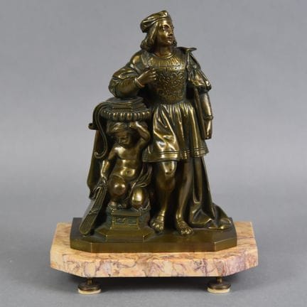 FIGURA de bronce que representa a un arquitecto de