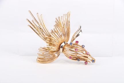 Spilla a forma di mazzo annodato in oro rosa 18 ca