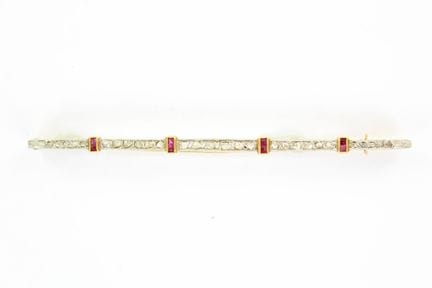 18K yellow gold hair clip adorned with a row of ro