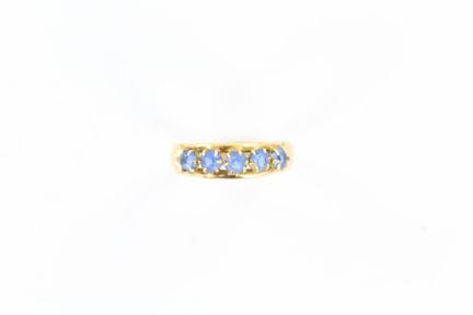 14K yellow gold ring set with a row of 5 blue ston