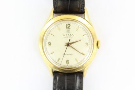 Cyma
Chic montre de ville en or jaune 18K 750 mill