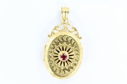 Pendentif ouvrant ovale en or jaune 18 K agrémenté