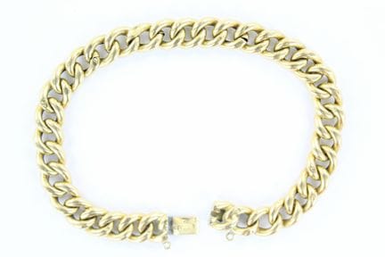 Bracelet gourmette en or jaune 18 K (chocs). Long.