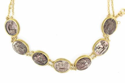 An 18K yellow gold double-row necklace adorned wit