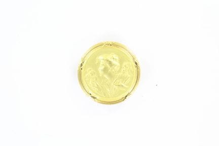 Round 18K yellow gold brooch featuring a female bu