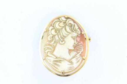 Brooch featuring a shell cameo depicting a woman's