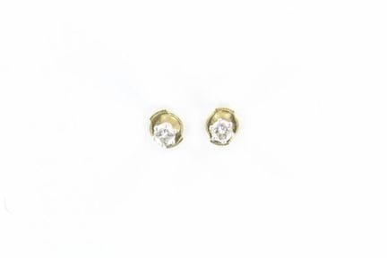 A pair of 18K white gold earrings, each set with a