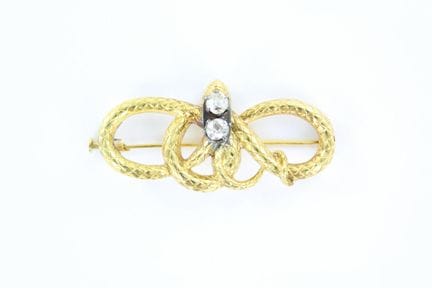 18K yellow gold brooch depicting a snake forming a