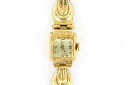 Women's watch with an 18K yellow gold case and bra