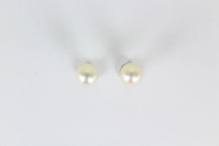 Pair of 18K white gold earrings, each featuring a 