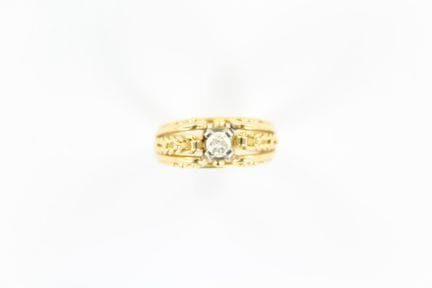 18K yellow gold ring set with a 0.20 ct diamond. S