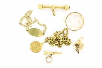 Gold set including a wedding band, chain and charm