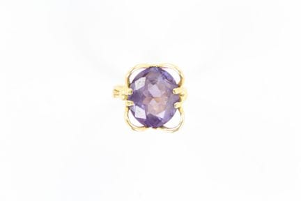 Yellow gold flower-style ring set with a central a