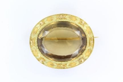 Ovale Brosche aus 18-karätigem Zweifarbgold, in de