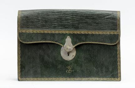 A green morocco leather case with six gussets, emb
