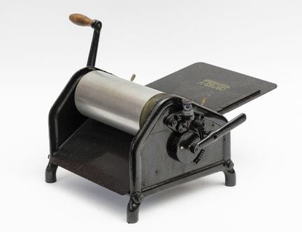 An ORMIG V alcohol duplicator made of black cast i