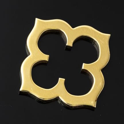 CARTIER. A four-lobed pendant in 750‰ yellow gold,