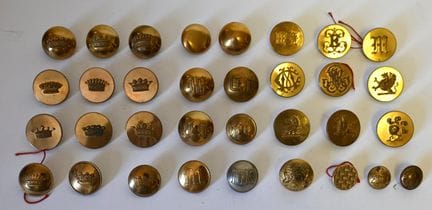 A set of 34 buttons featuring numerals or decorate
