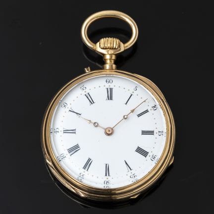 A 750‰ gold pocket watch with a round gold case ma