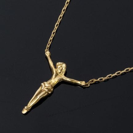 A 750‰ yellow gold necklace featuring a depiction 