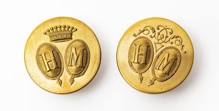 Two buttons marked "H.M." beneath a count's crown.