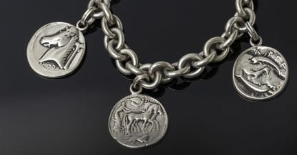 A 925‰ silver bracelet adorned with three pendants
